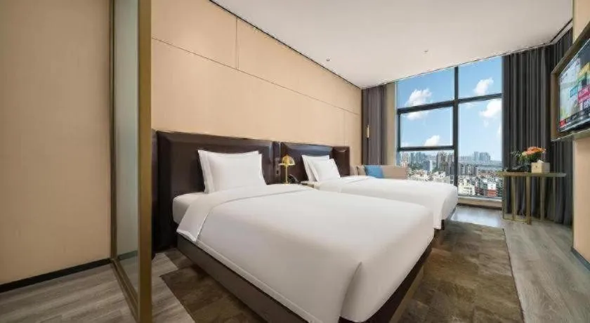 Bed in Premier City Comfort Hotel Quanzhou Wanda Plaza
