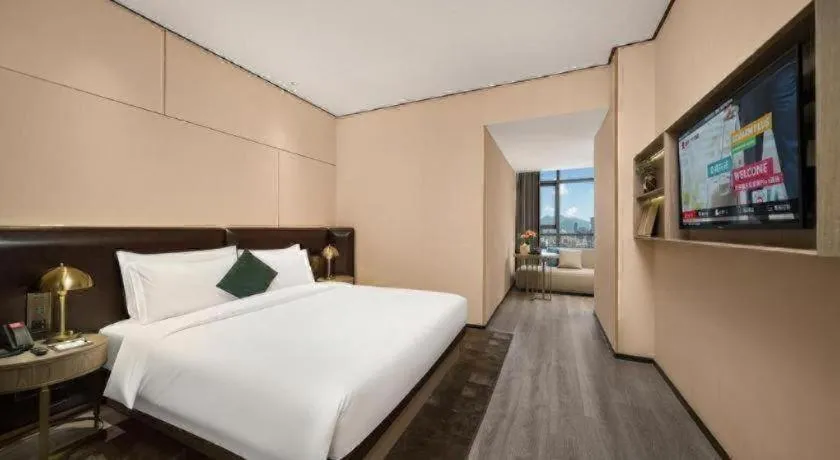 Bed in Premier City Comfort Hotel Quanzhou Wanda Plaza