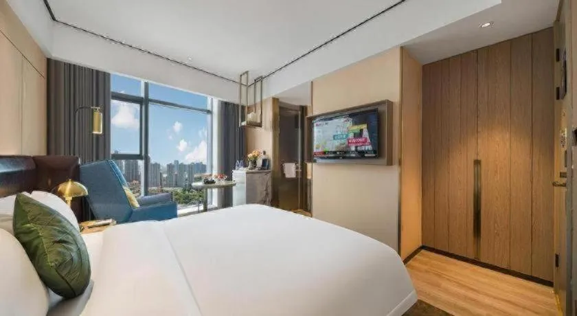 Bed in Premier City Comfort Hotel Quanzhou Wanda Plaza