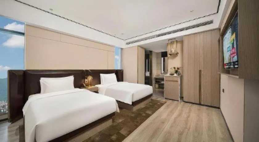 Bed in Premier City Comfort Hotel Quanzhou Wanda Plaza