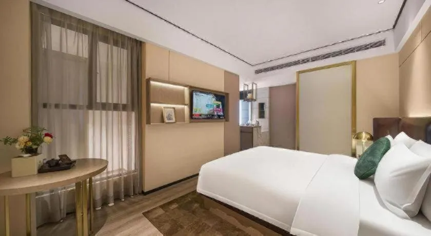Bed in Premier City Comfort Hotel Quanzhou Wanda Plaza