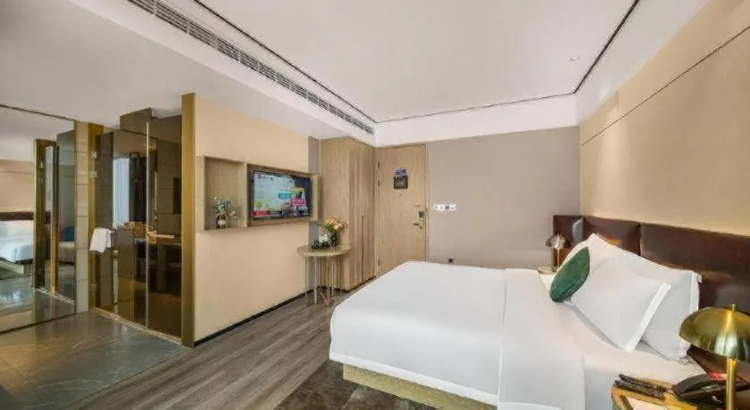 Bed in Premier City Comfort Hotel Quanzhou Wanda Plaza