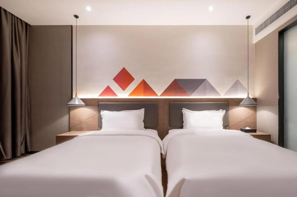 Bed in Borrman Hotel Zhonghsan Guzheng Huayi Plaza Light Rail Station
