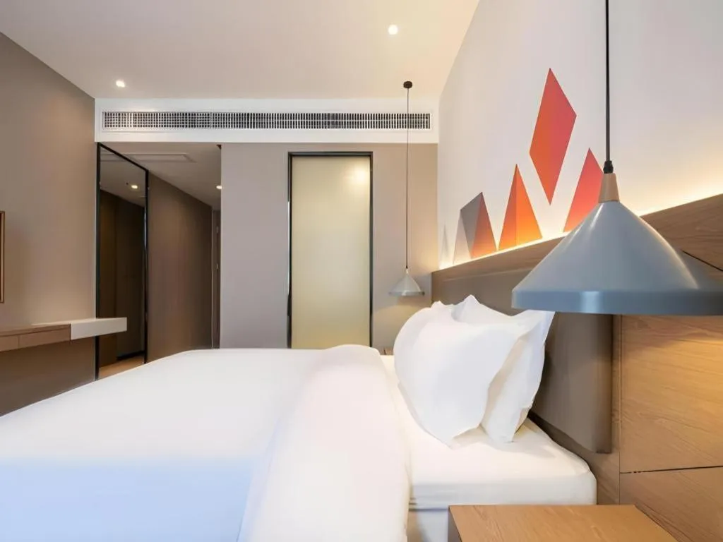 Bed in Borrman Hotel Zhonghsan Guzheng Huayi Plaza Light Rail Station