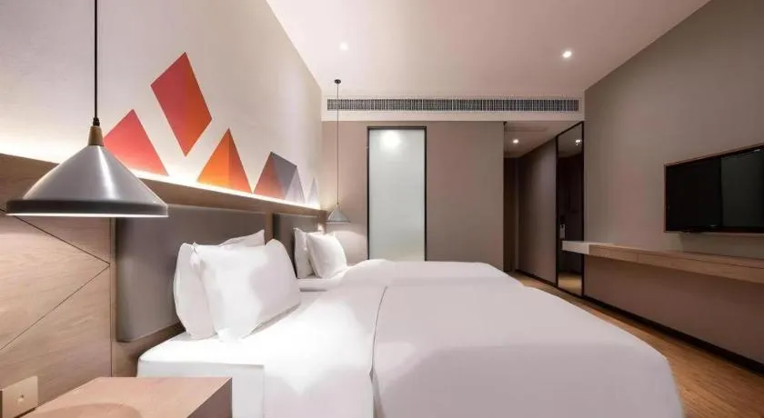 Bed in Borrman Hotel Zhonghsan Guzheng Huayi Plaza Light Rail Station