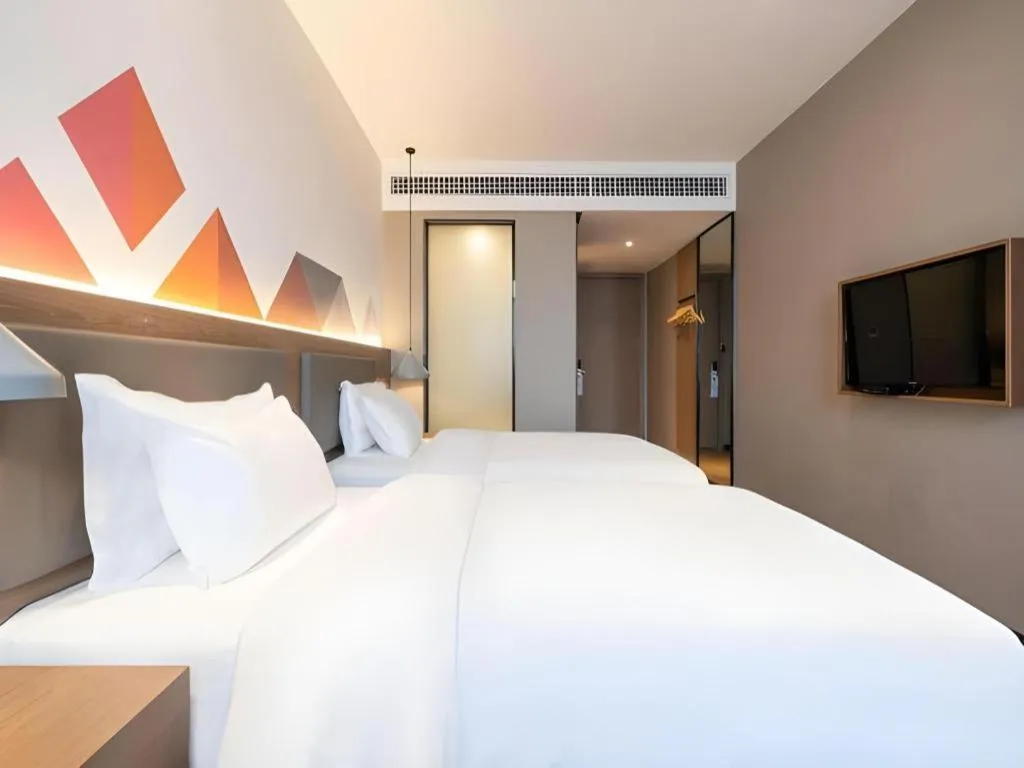 Bed in Borrman Hotel Zhonghsan Guzheng Huayi Plaza Light Rail Station