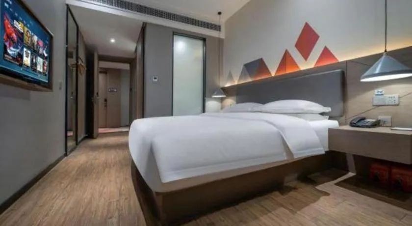 Bed in Borrman Hotel Zhonghsan Guzheng Huayi Plaza Light Rail Station