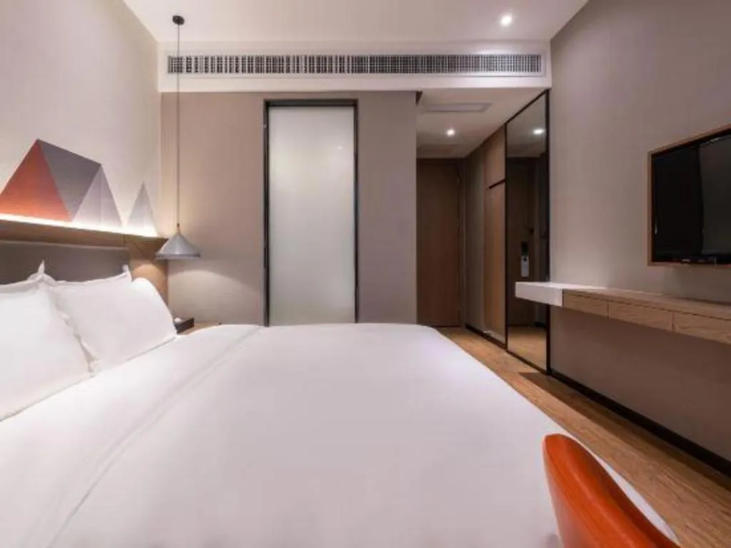 Bed in Borrman Hotel Zhonghsan Guzheng Huayi Plaza Light Rail Station