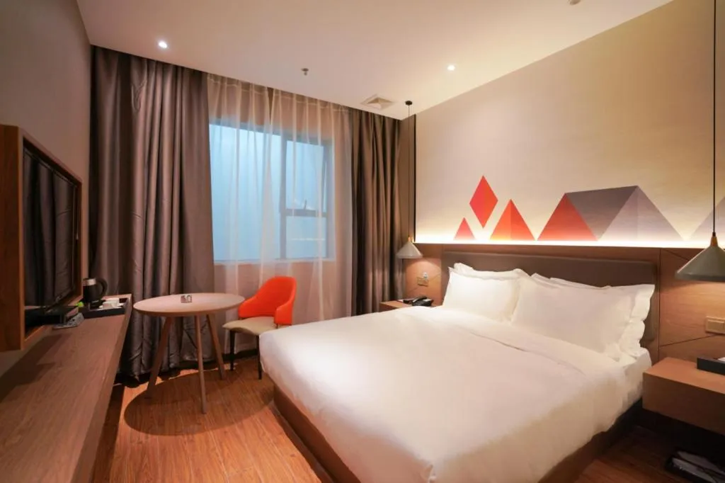 Bed in Borrman Hotel Zhonghsan Guzheng Huayi Plaza Light Rail Station