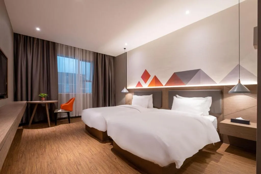 Bed in Borrman Hotel Zhonghsan Guzheng Huayi Plaza Light Rail Station