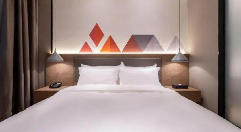 Bed in Borrman Hotel Zhonghsan Guzheng Huayi Plaza Light Rail Station