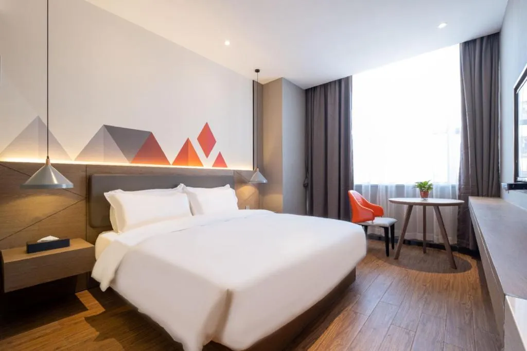 Bed in Borrman Hotel Zhonghsan Guzheng Huayi Plaza Light Rail Station