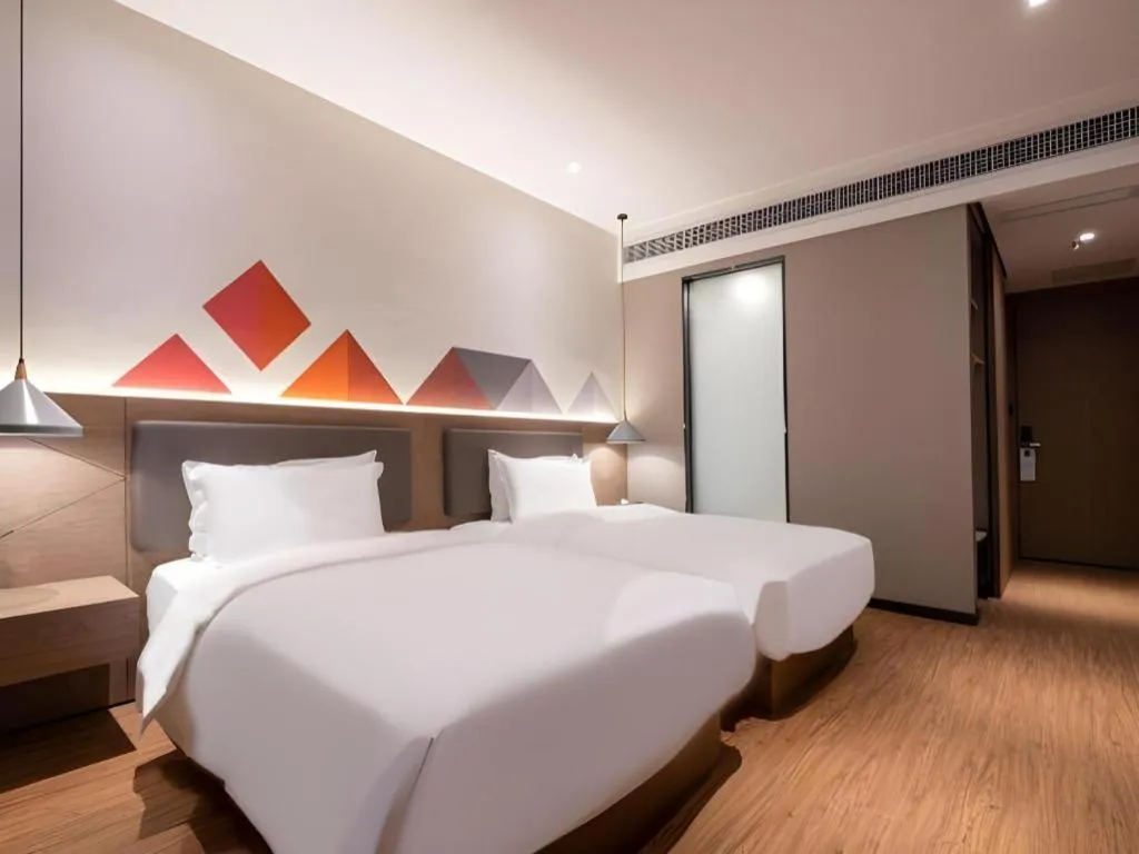 Bed in Borrman Hotel Zhonghsan Guzheng Huayi Plaza Light Rail Station