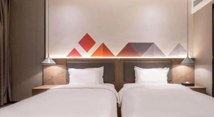 Bed in Borrman Hotel Zhonghsan Guzheng Huayi Plaza Light Rail Station