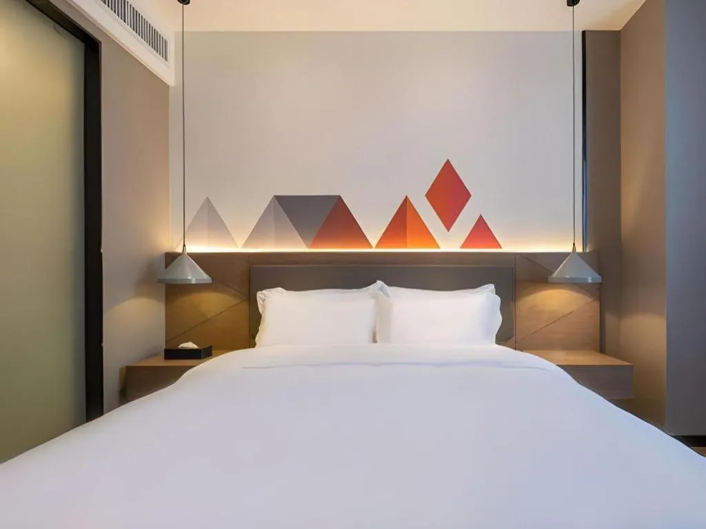 Bed in Borrman Hotel Zhonghsan Guzheng Huayi Plaza Light Rail Station