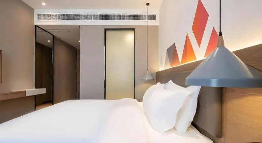 Bed in Borrman Hotel Zhonghsan Guzheng Huayi Plaza Light Rail Station