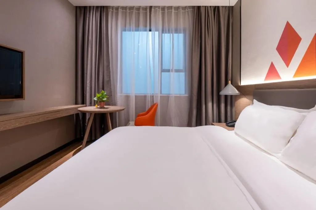 Bed in Borrman Hotel Zhonghsan Guzheng Huayi Plaza Light Rail Station