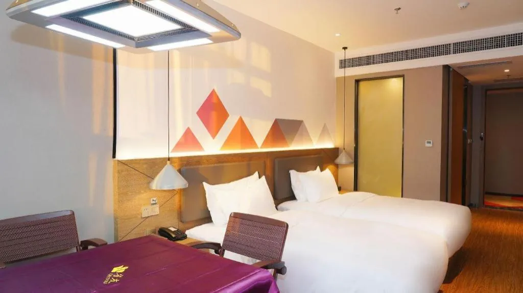 Bed in Borrman Hotel Zhonghsan Guzheng Huayi Plaza Light Rail Station