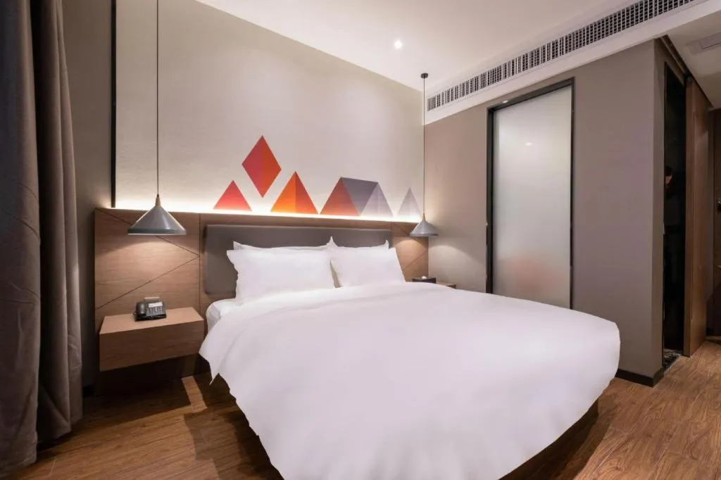 Bed in Borrman Hotel Zhonghsan Guzheng Huayi Plaza Light Rail Station