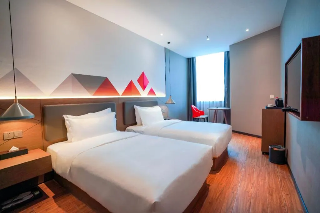 Bed in Borrman Hotel Zhonghsan Guzheng Huayi Plaza Light Rail Station