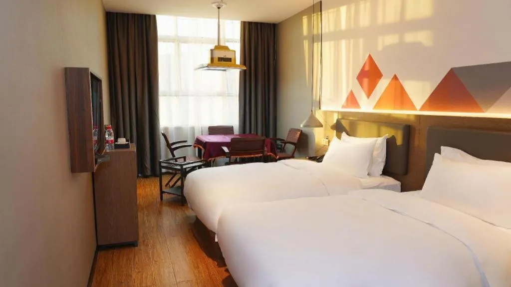 Bed in Borrman Hotel Zhonghsan Guzheng Huayi Plaza Light Rail Station