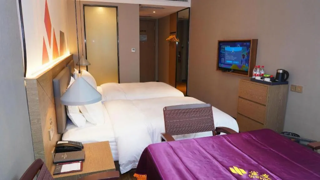 Bed in Borrman Hotel Zhonghsan Guzheng Huayi Plaza Light Rail Station