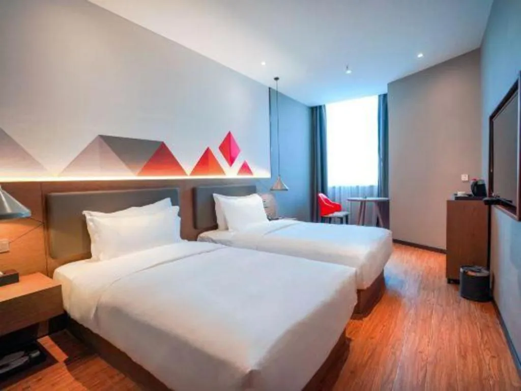 Bed in Borrman Hotel Zhonghsan Guzheng Huayi Plaza Light Rail Station