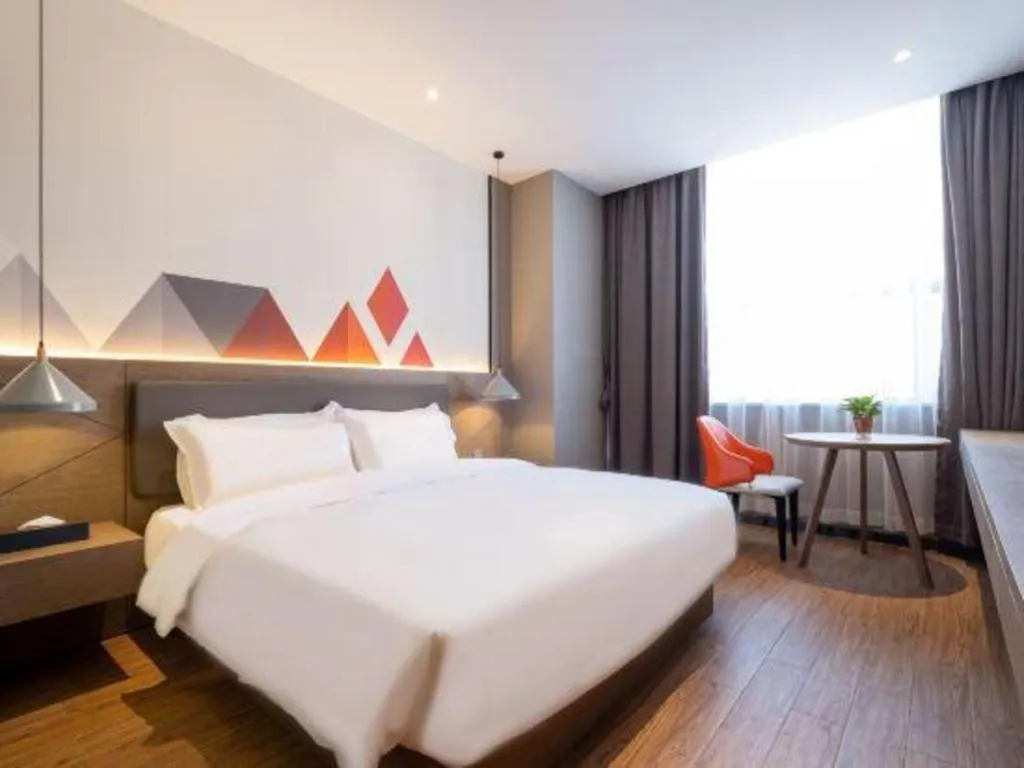 Bed in Borrman Hotel Zhonghsan Guzheng Huayi Plaza Light Rail Station