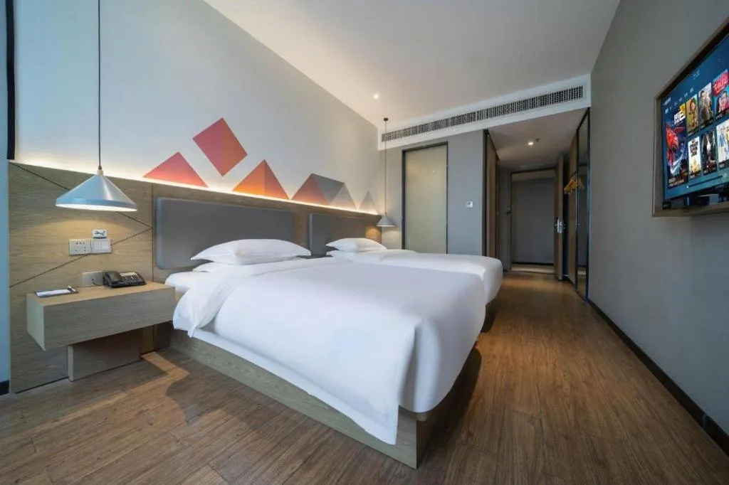 Bed in Borrman Hotel Zhonghsan Guzheng Huayi Plaza Light Rail Station