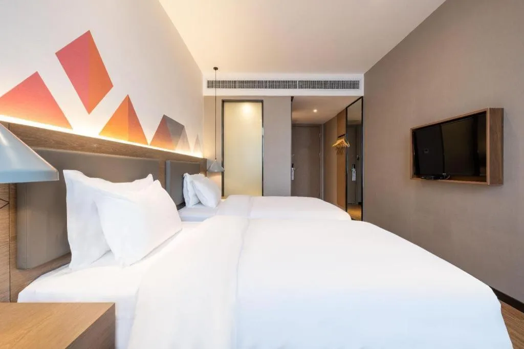 Bed in Borrman Hotel Zhonghsan Guzheng Huayi Plaza Light Rail Station