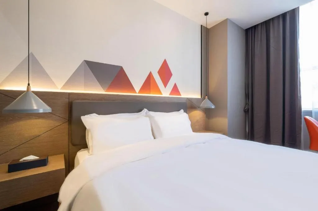 Bed in Borrman Hotel Zhonghsan Guzheng Huayi Plaza Light Rail Station