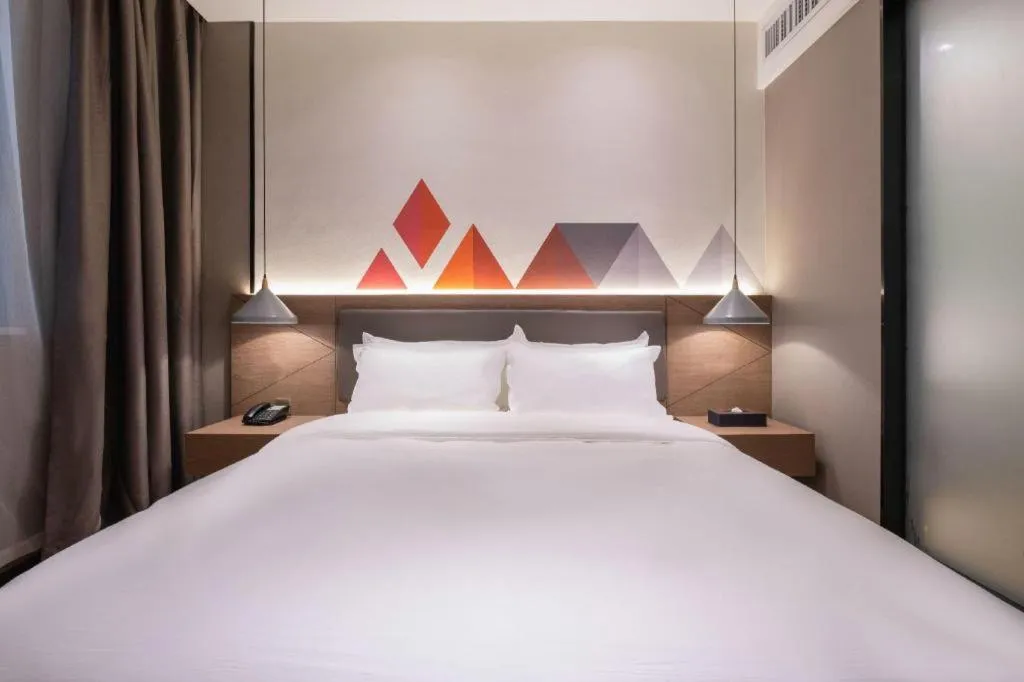 Bed in Borrman Hotel Zhonghsan Guzheng Huayi Plaza Light Rail Station