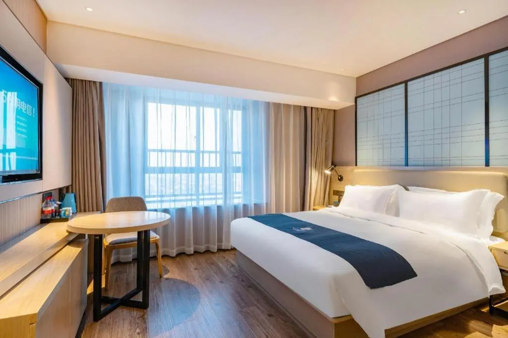 Bed in Echarm Hotel Suzhou Shengze Oriental Extile City