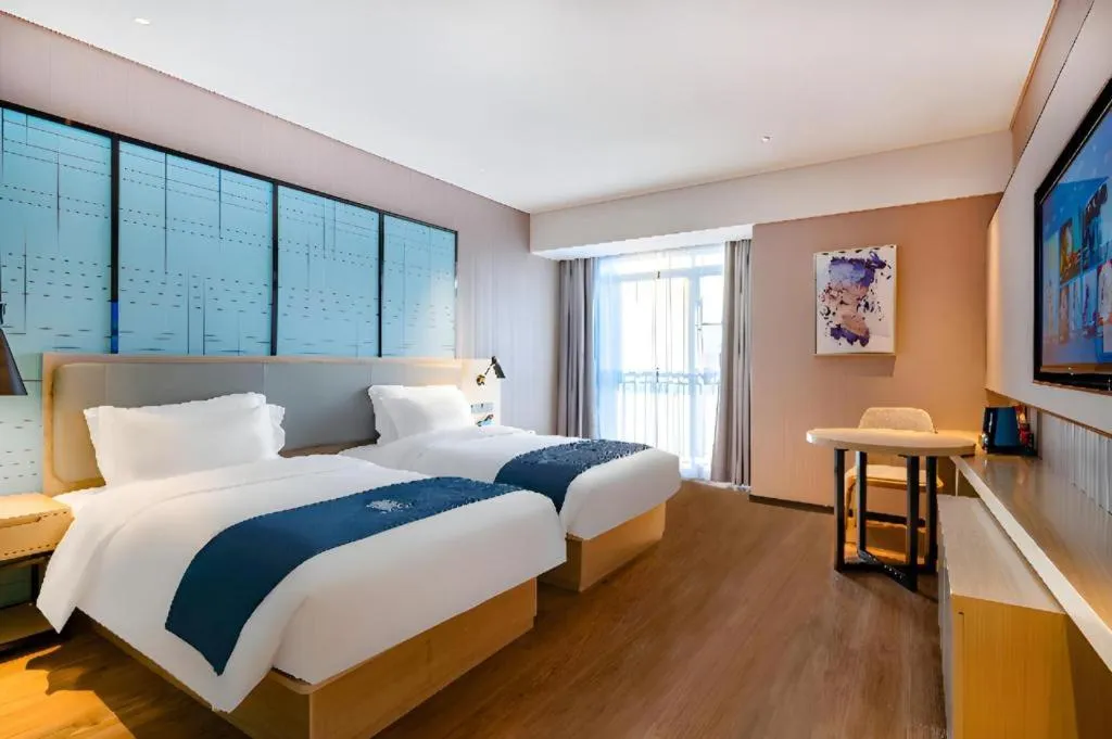 Bed in Echarm Hotel Suzhou Shengze Oriental Extile City