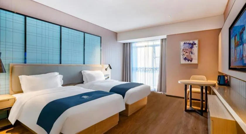 Bed in Echarm Hotel Suzhou Shengze Oriental Extile City