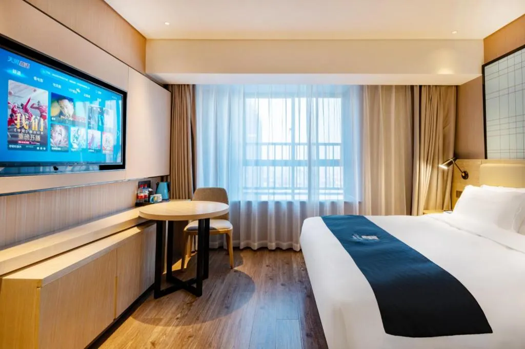 Bed in Echarm Hotel Suzhou Shengze Oriental Extile City