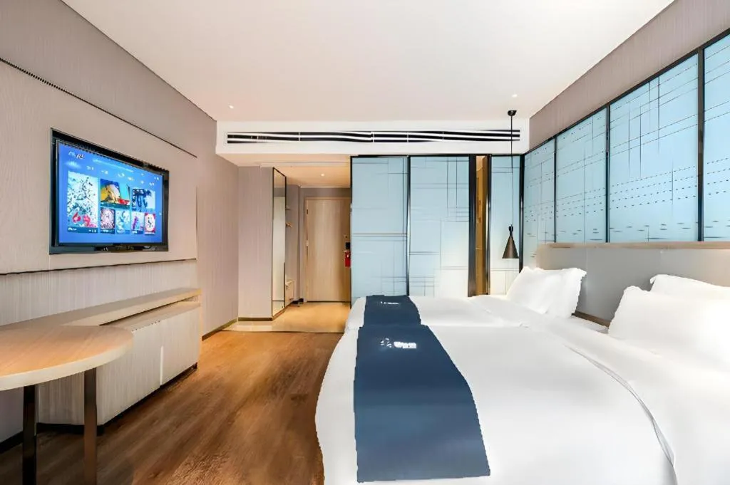Bed in Echarm Hotel Suzhou Shengze Oriental Extile City