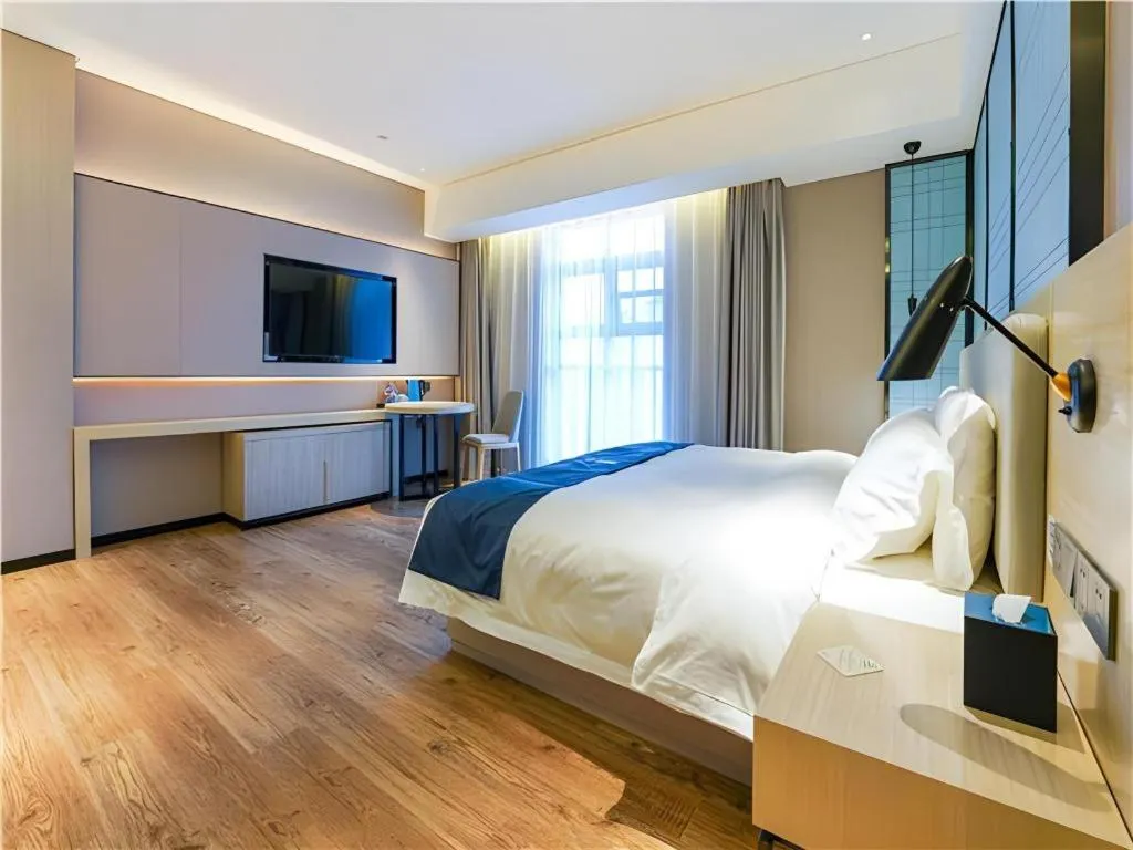 Bed in Echarm Hotel Suzhou Shengze Oriental Extile City