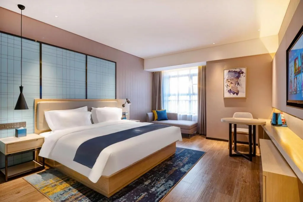 Bed in Echarm Hotel Suzhou Shengze Oriental Extile City
