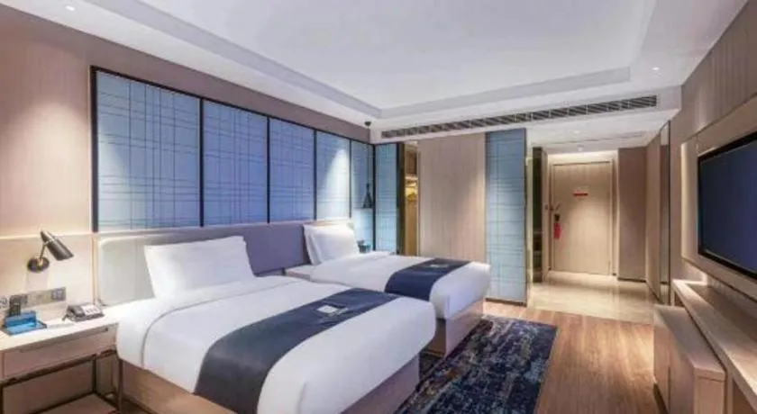 Bed in Echarm Hotel Suzhou Shengze Oriental Extile City