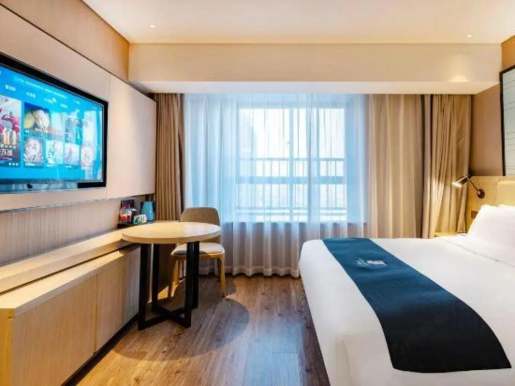 Bed in Echarm Hotel Suzhou Shengze Oriental Extile City