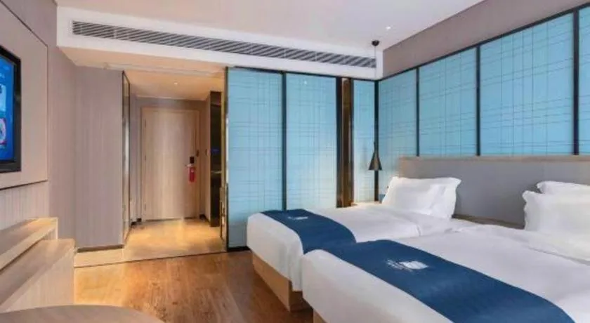Bed in Echarm Hotel Suzhou Shengze Oriental Extile City