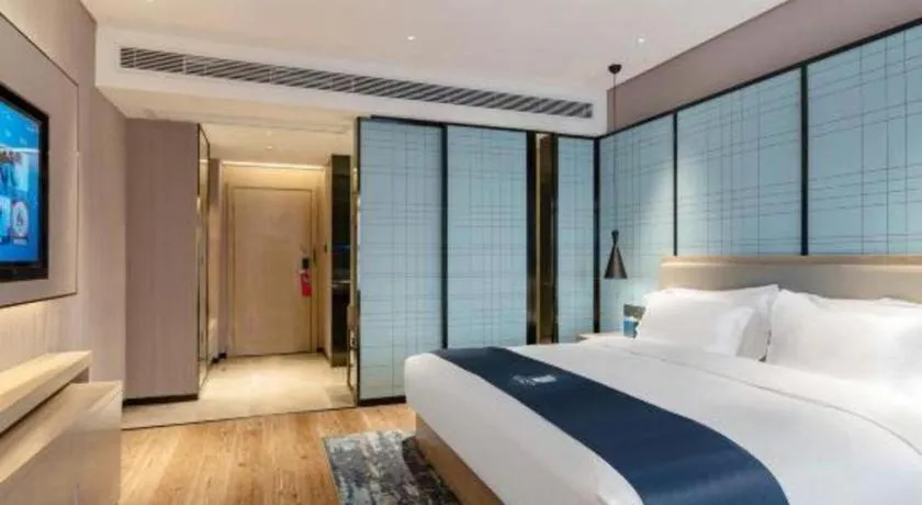 Bed in Echarm Hotel Suzhou Shengze Oriental Extile City