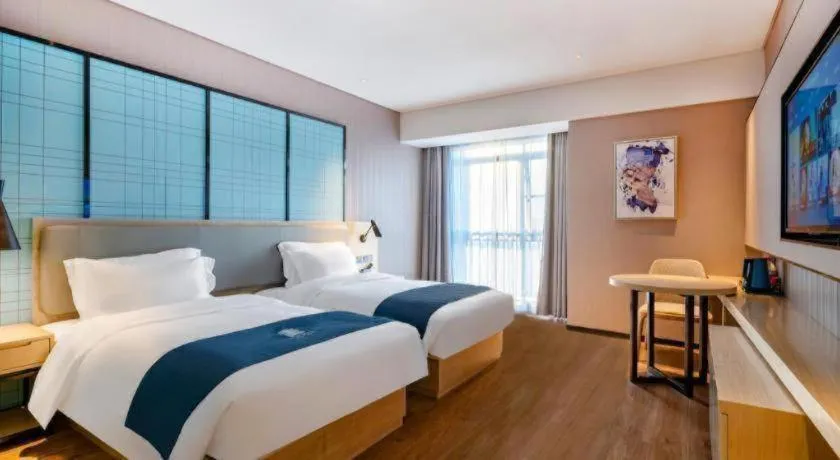 Bed in Echarm Hotel Suzhou Shengze Oriental Extile City