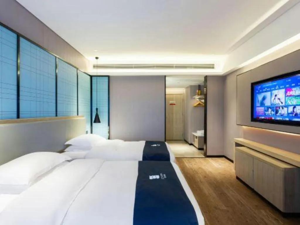 Bed in Echarm Hotel Suzhou Shengze Oriental Extile City