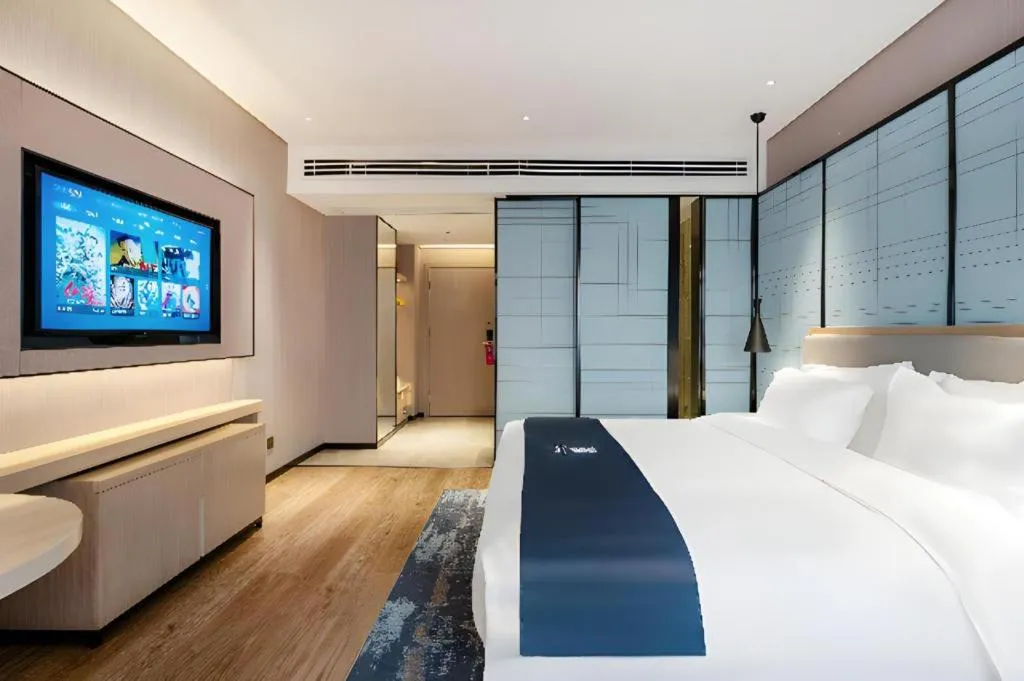 Bed in Echarm Hotel Suzhou Shengze Oriental Extile City