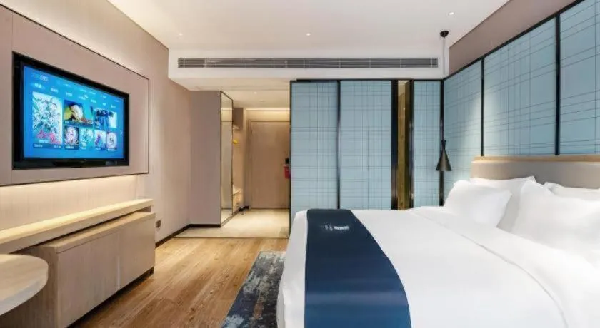 Bed in Echarm Hotel Suzhou Shengze Oriental Extile City