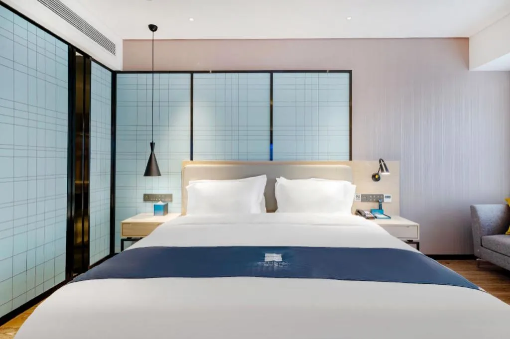 Bed in Echarm Hotel Suzhou Shengze Oriental Extile City