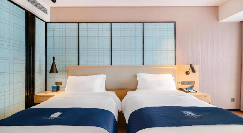 Bed in Echarm Hotel Suzhou Shengze Oriental Extile City