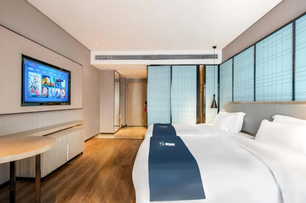 Bed in Echarm Hotel Suzhou Shengze Oriental Extile City